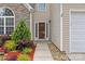 Inviting front entrance with a decorative garden bed and walkway at 516 Cool Creek Dr, Rock Hill, SC 29732