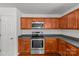 Galley kitchen featuring stainless steel appliances and wood cabinetry at 516 Cool Creek Dr, Rock Hill, SC 29732