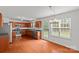 Well-lit kitchen with stainless steel appliances, wood cabinetry, and hardwood floors at 516 Cool Creek Dr, Rock Hill, SC 29732