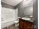 Bathroom featuring a shower-tub combination, vanity with sink, and modern gray and white color scheme at 5321 State Line Rd, Marshville, NC 28103
