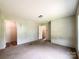 Spacious bedroom featuring neutral carpet, ample natural light, and a convenient closet space at 5321 State Line Rd, Marshville, NC 28103