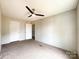 Bedroom with ceiling fan and connecting doors at 5321 State Line Rd, Marshville, NC 28103
