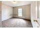 A cozy bedroom with neutral tones features a window for natural light and soft, neutral carpeting at 5321 State Line Rd, Marshville, NC 28103