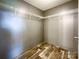 Walk-in closet with vinyl flooring and shelving for organization at 5321 State Line Rd, Marshville, NC 28103