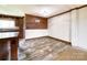 Warm dining area showcasing wood-look flooring and decorative wood wall at 5321 State Line Rd, Marshville, NC 28103