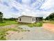 Single-story home featuring vinyl siding, dark shutters, and small front porch at 5321 State Line Rd, Marshville, NC 28103