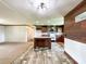 Bright and airy kitchen with an island, modern appliances, and wood-look flooring at 5321 State Line Rd, Marshville, NC 28103