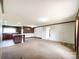 Open-concept living room with carpet, connecting seamlessly to the kitchen and dining area at 5321 State Line Rd, Marshville, NC 28103