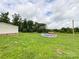 A spacious yard features a partially above-ground pool and a red shed in the background at 5321 State Line Rd, Marshville, NC 28103