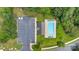 Overhead aerial view of the community pool, parking area, and green space in the community at 6000 Boathouse Ln # C, Cramerton, NC 28032
