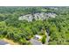 Lovely aerial view of the community surrounded by lush green trees and a community pool at 6000 Boathouse Ln # C, Cramerton, NC 28032