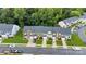Aerial view of townhomes with green lawns and tree-lined streets at 6000 Boathouse Ln # C, Cramerton, NC 28032