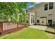 Backyard features a wood deck, concrete patio, and green lawn at 6000 Boathouse Ln # C, Cramerton, NC 28032