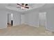Bright bedroom with carpeted floors, neutral walls and a tray ceiling with fan at 6000 Boathouse Ln # C, Cramerton, NC 28032