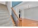 Inviting entryway featuring a staircase with wood railings and a view into the adjacent room at 6000 Boathouse Ln # C, Cramerton, NC 28032