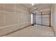 Spacious two-car garage featuring an automatic door opener and overhead storage shelves at 6000 Boathouse Ln # C, Cramerton, NC 28032