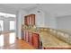 Kitchen with granite countertops, wood cabinets and open floor plan at 6000 Boathouse Ln # C, Cramerton, NC 28032