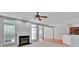 Living room features a fireplace, neutral carpet, and open access to the kitchen with bar seating at 6000 Boathouse Ln # C, Cramerton, NC 28032