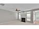 Bright living room with fireplace, neutral carpet, recessed lighting, and large windows offers plenty of sunlight at 6000 Boathouse Ln # C, Cramerton, NC 28032