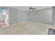 Spacious living room with neutral carpet, ceiling fan, and bright light, perfect for comfortable living at 6000 Boathouse Ln # C, Cramerton, NC 28032