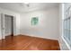 Bright bedroom with hardwood floors, closet, and a large window at 6259 River Cabin Ln, Charlotte, NC 28278