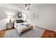 Comfortable bedroom with area rug, ceiling fan, and bright natural light at 6259 River Cabin Ln, Charlotte, NC 28278