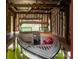 Well-maintained boat inside of boathouse featuring protective covering and an electric winch for easy storage at 6259 River Cabin Ln, Charlotte, NC 28278