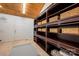 Spacious closet features custom built-ins and shelving, plus a high ceiling at 6259 River Cabin Ln, Charlotte, NC 28278