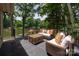 Cozy deck with comfortable seating and a picturesque lake view at 6259 River Cabin Ln, Charlotte, NC 28278