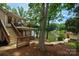 Multi-level home featuring lake access, wooden stairs, private balconies offering stunning water views and outdoor enjoyment at 6259 River Cabin Ln, Charlotte, NC 28278