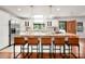 Modern kitchen with stainless steel appliances, a spacious island, and sleek bar stools at 6259 River Cabin Ln, Charlotte, NC 28278