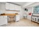 Functional laundry room with ample storage, a utility sink, and organized laundry bags at 6259 River Cabin Ln, Charlotte, NC 28278