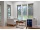 Bright living room with armchairs, a lake view, and a wood floor for comfortable living at 6259 River Cabin Ln, Charlotte, NC 28278