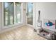 Well-lit mud room with tiled floors, a dog bed, and convenient access to the outdoors at 6259 River Cabin Ln, Charlotte, NC 28278
