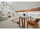 Bright home office with a glass desk, a comfortable chair, and a view of the surrounding neighborhood at 6259 River Cabin Ln, Charlotte, NC 28278