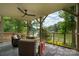 Relaxing covered patio boasts scenic water views, comfortable seating and an ideal spot for outdoor enjoyment at 6259 River Cabin Ln, Charlotte, NC 28278