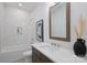 Bathroom showcasing a modern vanity with ample countertop space and a sleek, tiled shower at 7011 Chateau Bordeaux Ln, Charlotte, NC 28270