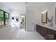 Elegant bathroom with a soaking tub, spacious vanity, and modern fixtures at 7011 Chateau Bordeaux Ln, Charlotte, NC 28270