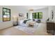 Relaxing bedroom with large windows and elegant furnishings at 7011 Chateau Bordeaux Ln, Charlotte, NC 28270