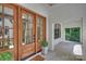 Inviting front entrance featuring wood door with glass panes and a charming porch at 7011 Chateau Bordeaux Ln, Charlotte, NC 28270