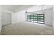 Spacious garage with sealed concrete floor and a modern glass door allowing for natural light at 7011 Chateau Bordeaux Ln, Charlotte, NC 28270