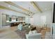 Comfortable living room showcasing an open layout with a modern kitchen and stylish decor at 7011 Chateau Bordeaux Ln, Charlotte, NC 28270