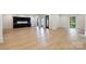 Open living room featuring hardwood floors, recessed lights, and black framed windows at 7011 Chateau Bordeaux Ln, Charlotte, NC 28270