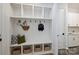 Bright mudroom features built-in shelving, bench, and storage baskets for seamless organization at 7011 Chateau Bordeaux Ln, Charlotte, NC 28270