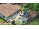 Aerial view of home featuring a brick patio, deck with hot tub, lush landscaping at 7164 Moss Point Dr, Charlotte, NC 28277