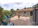 Brick patio with outdoor seating in backyard at 7164 Moss Point Dr, Charlotte, NC 28277