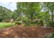 Backyard garden with lush landscaping at 7164 Moss Point Dr, Charlotte, NC 28277