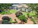A well-manicured backyard features a lush lawn, patio, and decorative landscaping providing ample space for relaxation and entertainment at 7164 Moss Point Dr, Charlotte, NC 28277