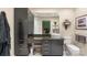 Modern bathroom with dark cabinets, granite countertops, vessel sink, and decorative accents at 7164 Moss Point Dr, Charlotte, NC 28277
