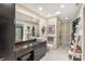 Bright bathroom featuring a vessel sink, a large mirror, and a stylish tiled shower at 7164 Moss Point Dr, Charlotte, NC 28277